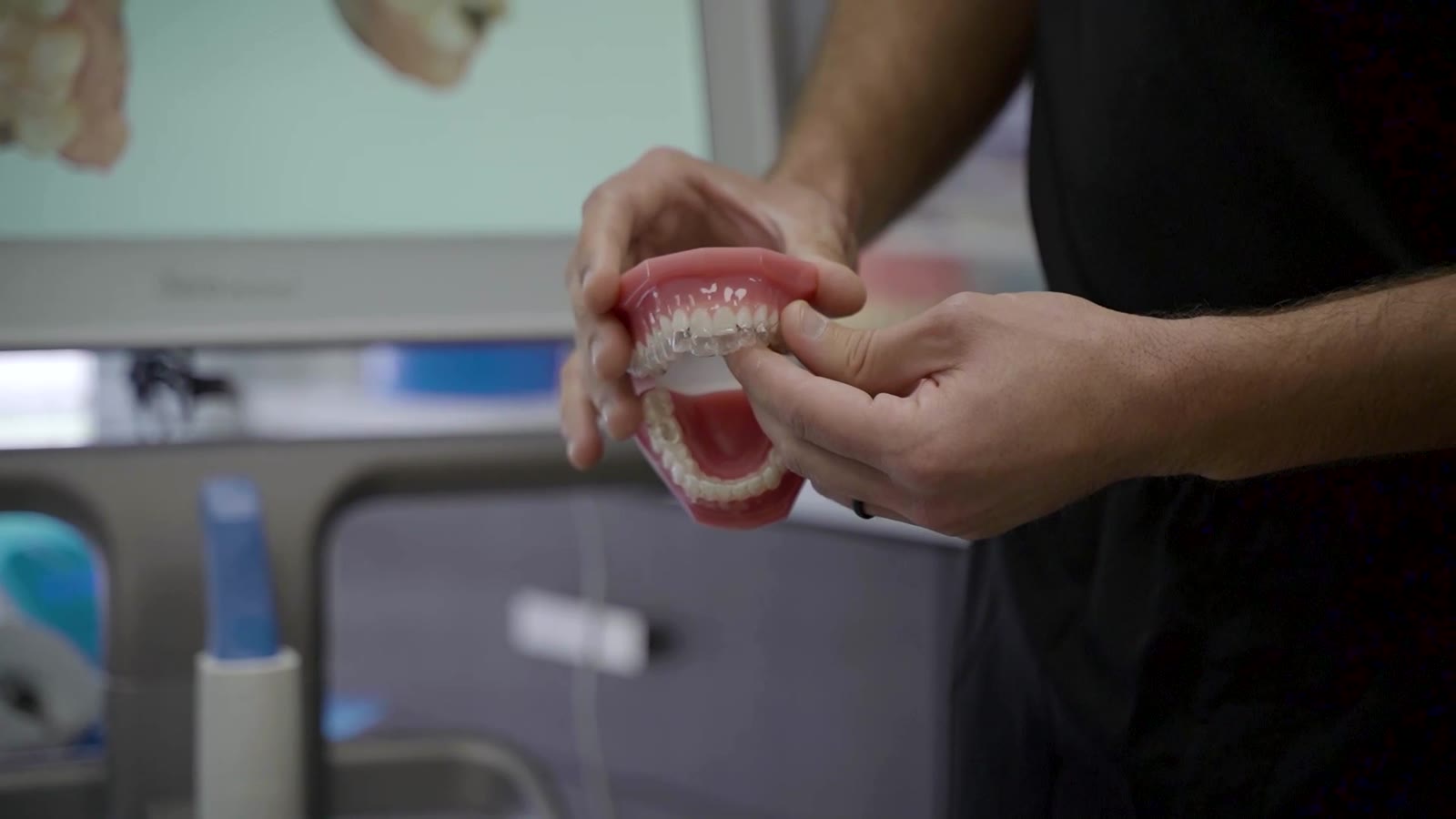 Dentist holding a dental model